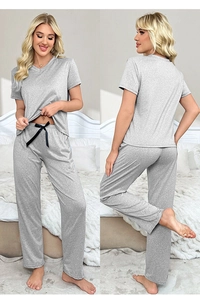 Detail of grey knitted 3-piece loungewear set with V-neck top and bow drawstring pants