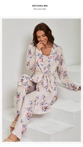 Detail of dry rose floral satin pajama set featuring silk-like fabric and tie-waist robe