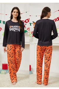 Detail of Happy Halloween print on long sleeve top and pumpkin pattern pajama pants