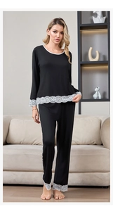 Detailed view of women's modal cotton pajama set with elegant white lace trim accents