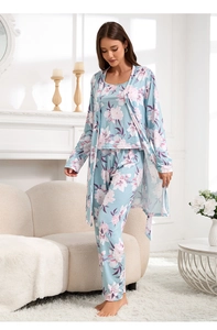 Detail view of light blue floral loungewear set featuring robe, cami, and long pants