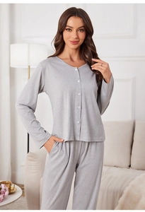 Detail of grey knitted cotton loungewear set with V-neck button-up top and matching pants