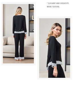 Detail of elegant black modal pajamas with white lace trim on sleeves and hem