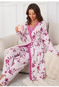 Detail showing the floral print texture and pink contrast trim on a cotton robe set