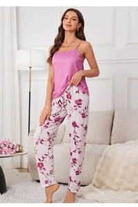 Detailed view of pink spaghetti strap top and floral trousers pajama lounge set