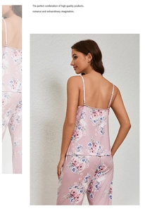 Detail of pink floral satin pajama set featuring silk-like texture and elegant rose print