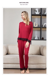 Close-up of elegant dry rose modal pajamas with intricate black lace trim and piping details