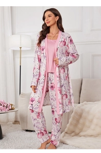 Detailed texture of pink floral pajama set featuring a soft robe, camisole and long pants