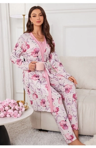 Lifestyle shot of three-piece floral pajamas set with robe, camisole and pants