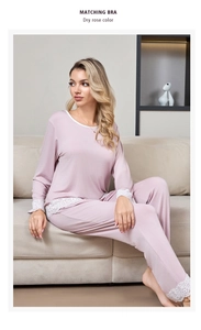 Detailed view of delicate white floral lace trim on dry rose modal pajama set cuffs