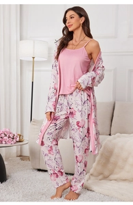 Three-piece pajama set featuring pink camisole with floral robe and matching trousers