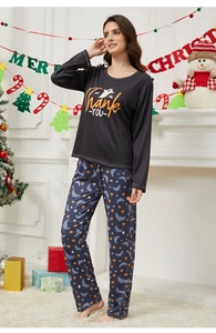 Detail of long-sleeve pajama set with Halloween ghost print and star pattern pants