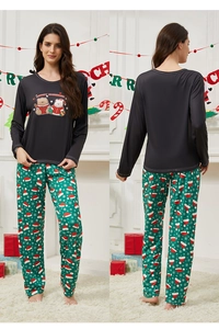 Detail of Christmas pajamas set with teddy bear print and festive pattern pants