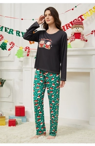 Cozy Christmas pajama set detail with cartoon top and snowflake print pants