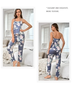 Detail view of light blue floral pajama set featuring spaghetti strap top and loose trousers