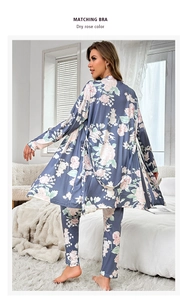 Detailed texture of grey-blue floral lounge robe and matching trousers set for women