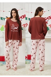 Close-up of women Christmas pajama set with reindeer print and Merry Christmas lettering