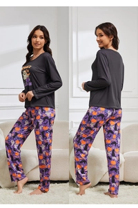 Detail of Halloween pajamas showing Spooky Season print and ghost pattern loungewear