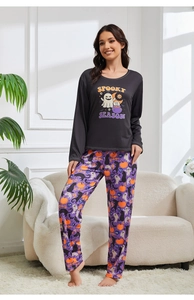 Detail of Spooky Season lettering on long-sleeve top with Halloween printed pajama pants