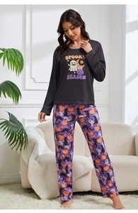 Detail of Spooky Season Halloween women's pajama set featuring ghost and pumpkin prints
