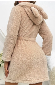 Detail view of plush warm bathrobe featuring cute long animal ear hood design