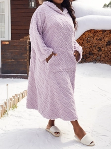 Detail of purple wearable blanket with embossed diamond texture and warm hooded design