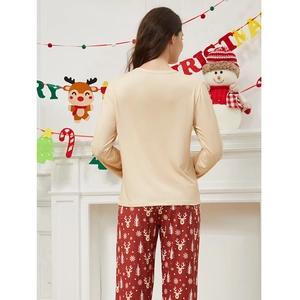 Women's two-piece Christmas pajama set featuring champagne top and reindeer print pants