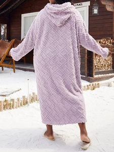 Detail of lavender plush hooded bathrobe with a textured diamond quilted pattern for winter