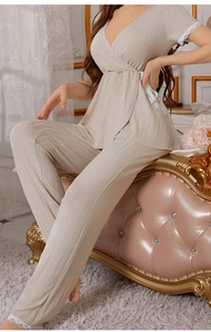 Detailed view of the V-neck knit loungewear set with elegant lace trims and ribbed texture