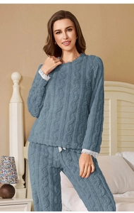 Detailed texture of dusty blue coral fleece pajamas with elegant white lace cuffs