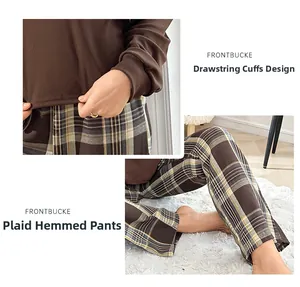 Détail des poignets côtelés et de l'ourlet du pantalon à carreaux pour cet ensemble