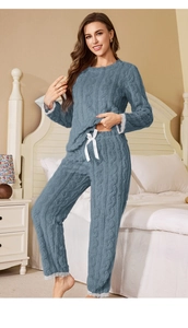 Detail of blue coral fleece pajama set with textured cable knit and white lace trims