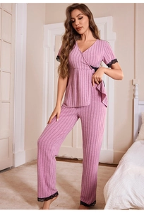 Detail of dusty rose rib-knit pajamas with V-neck wrap top and black lace trims