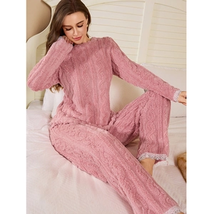 Pink coral fleece pajama set with jacquard pattern and white lace trim on sleeves and cuffs