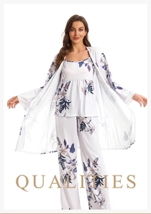 Detail showing the floral print on a white three-piece loungewear set with soft texture