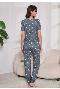 Relaxed fit women's pajama set featuring white star patterns on a grey-blue soft fabric