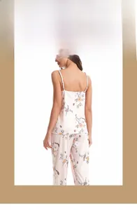 Detailed view of floral pink camisole and matching trousers in soft breathable cotton