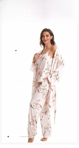 Detail view of floral cotton three-piece pajama set showing side pocket and hemmed cuffs