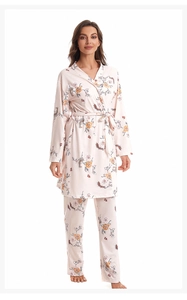 Close-up of floral cotton pajama set featuring vintage patterns and tie-waist robe detail