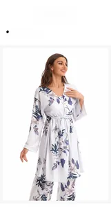 Detail view of cotton pajama set showing kimono collar and purple floral print pattern