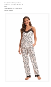 Detail of pink floral pajama set featuring black lace trim and satin texture