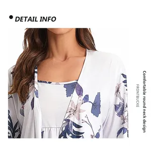 Detail of round neckline with soft pleats and blue floral print on white cotton fabric