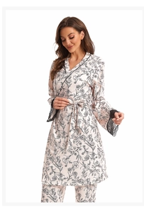 Detail of floral printed satin pajama set featuring delicate black lace trim on sleeves