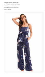 Close-up of three-piece navy floral pajama set showing satin trim and smooth fabric