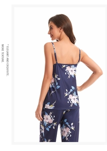 Detail of elegant dark blue floral pajama set featuring soft satin straps and fabric texture