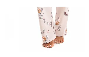 Detail of floral pajama pants leg opening featuring comfortable binding and soft cotton fabric