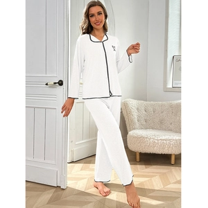 Three-piece white women's pajama set with black piping and heart detail in soft textured fabric