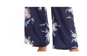 Detailed view of the wide-leg floral pajama pants hem with smooth stitched edging