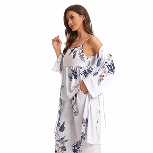 Three-piece floral pajama set with camisole, pants, and robe in soft cotton fabric
