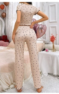 Close-up of heart print lounge set with ruffle edges and ribbed knit texture